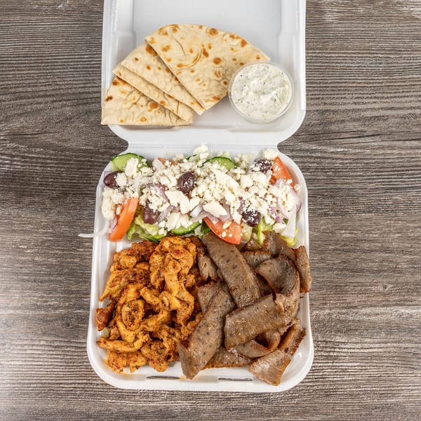Tony's Gyros Greek Cuisine's gyro platter with chicken, lamb, Greek salad, pita, and tzatziki.